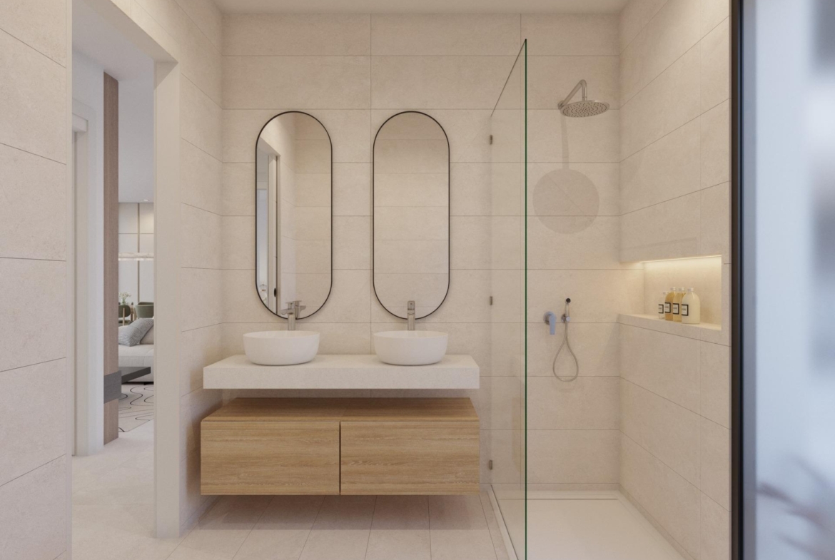 Neutral-toned bathroom with two oval mirrors, countertop basins and rain shower behind glass