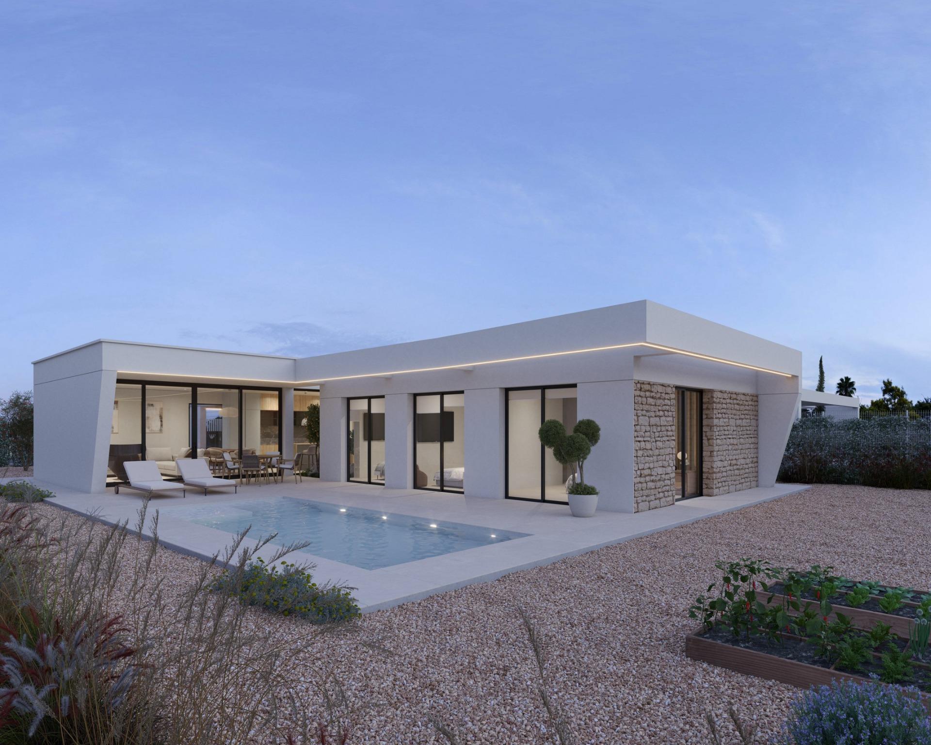 Single-storey modern villa exterior with pool, sun loungers and covered patio at dusk