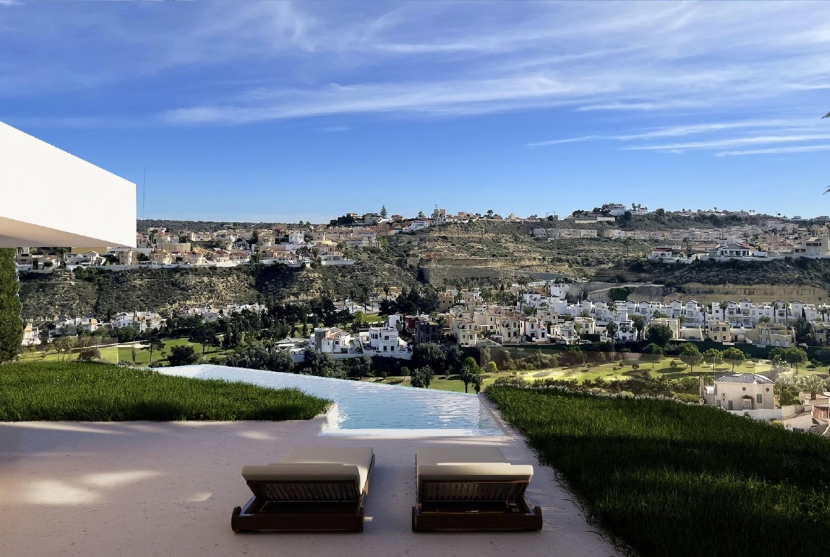 Terrace viewpoint with lounge chairs overlooking golf course and surrounding hillside homes