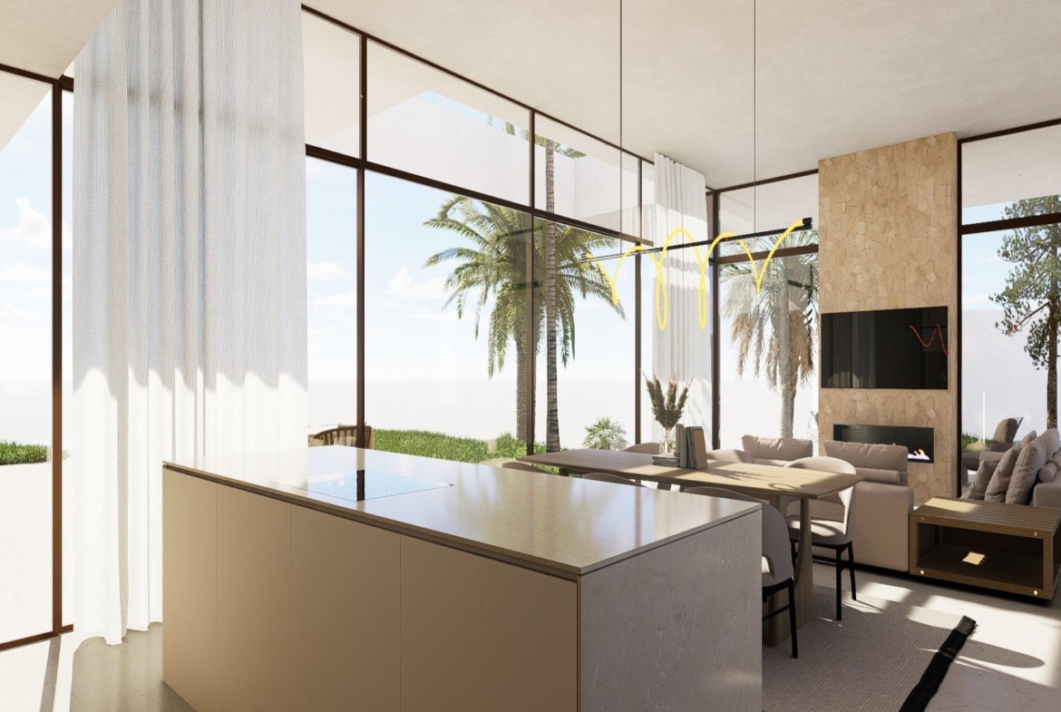 View from lounge across dining table to kitchen and glazed sliding doors to terrace