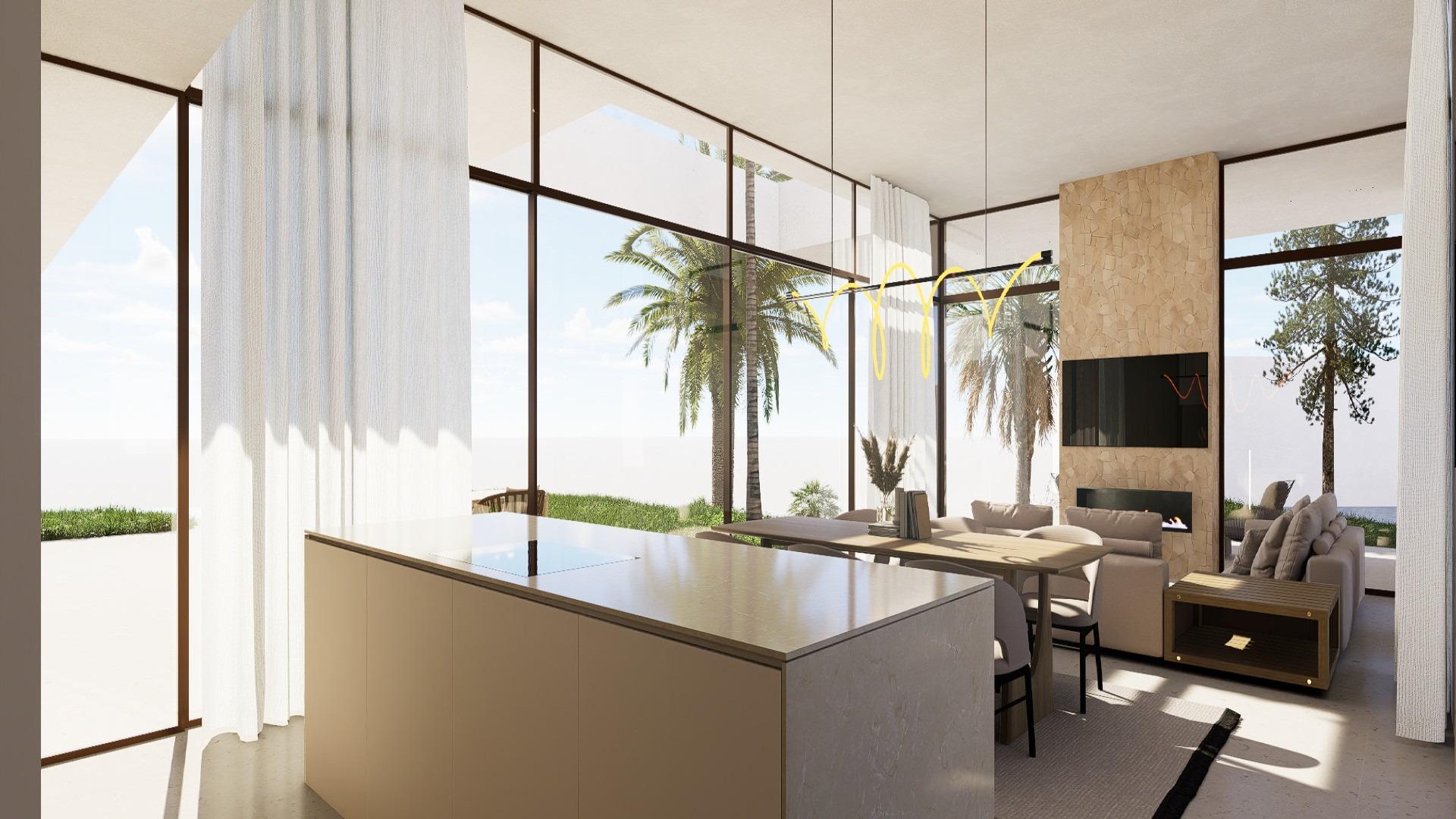 View from lounge across dining table to kitchen and glazed sliding doors to terrace