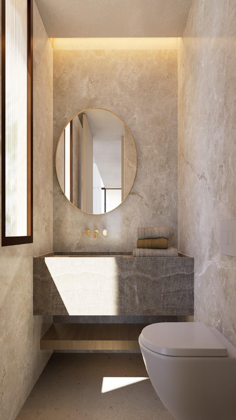 Dual-sink marble bathroom vanity with long mirror and corridor leading to bedroom