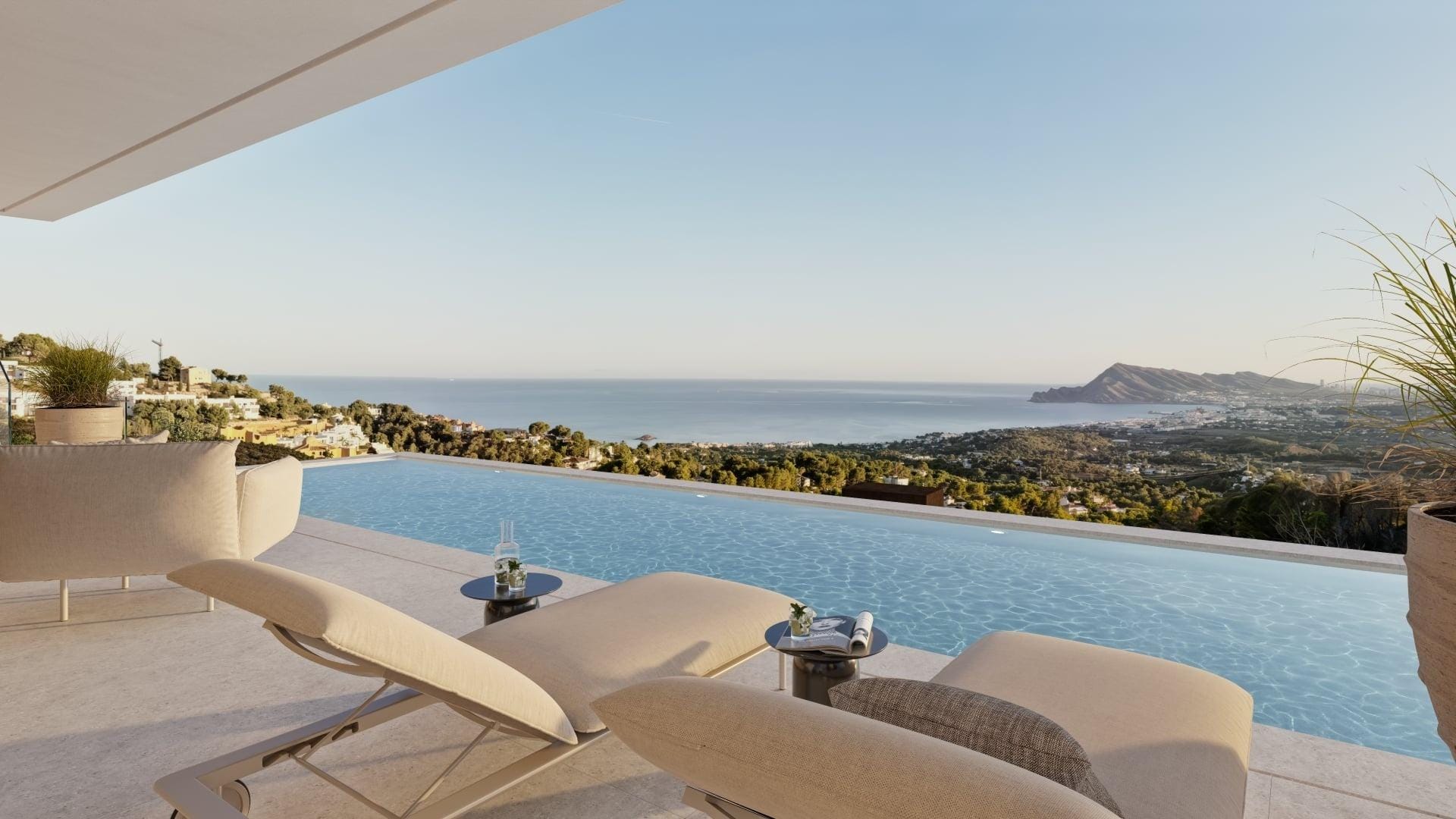 Covered terrace rendering with sun loungers beside an infinity pool and sea views in Sierra de Altea, Altea, Alicante