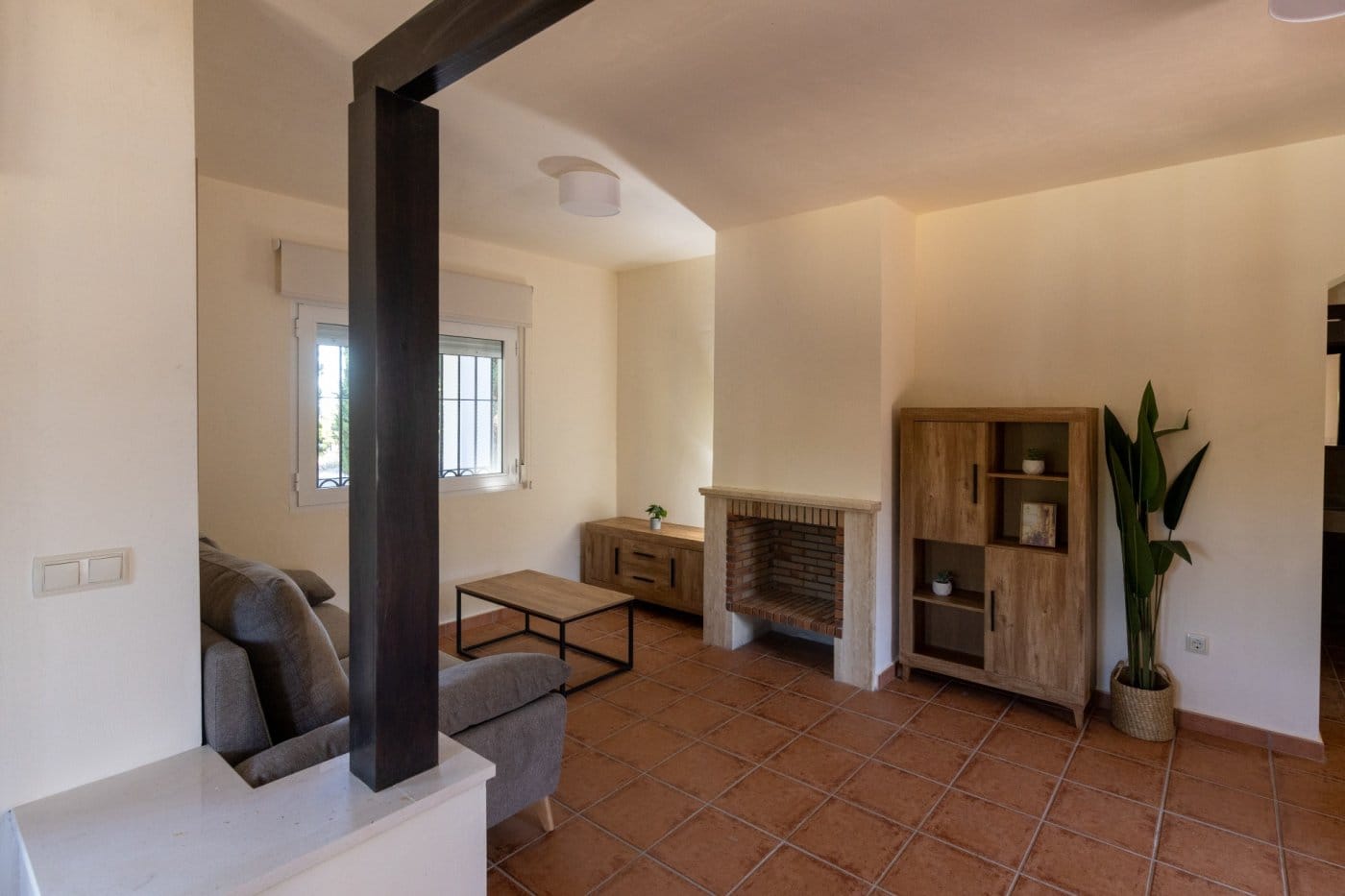 Fireplace and shelving beside the lounge seating in Las Palas, Fuente Álamo, Murcia