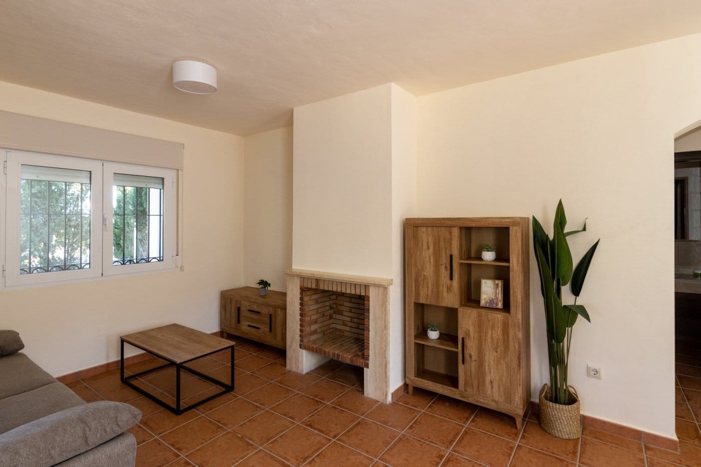 Lounge with a fireplace, shelving and tiled floor in Las Palas, Fuente Álamo, Murcia