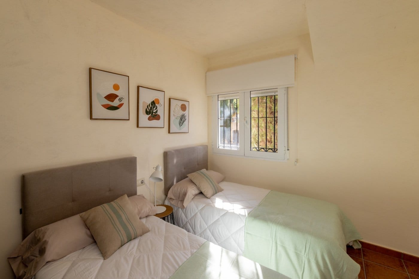 Twin bedroom with a window and upholstered headboards in Las Palas, Fuente Álamo, Murcia