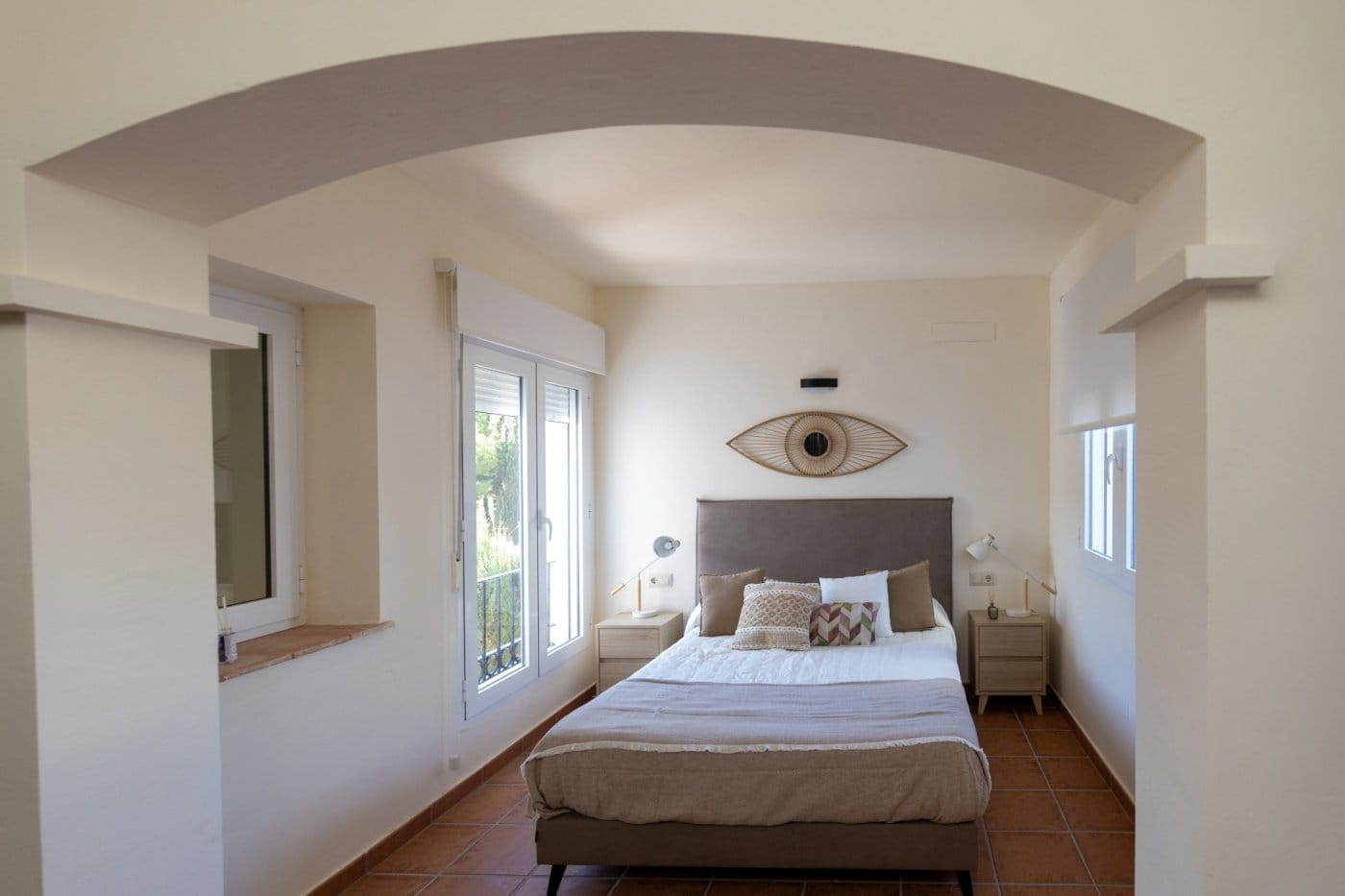 Double bedroom beneath a curved ceiling with patio doors in Las Palas, Fuente Álamo, Murcia