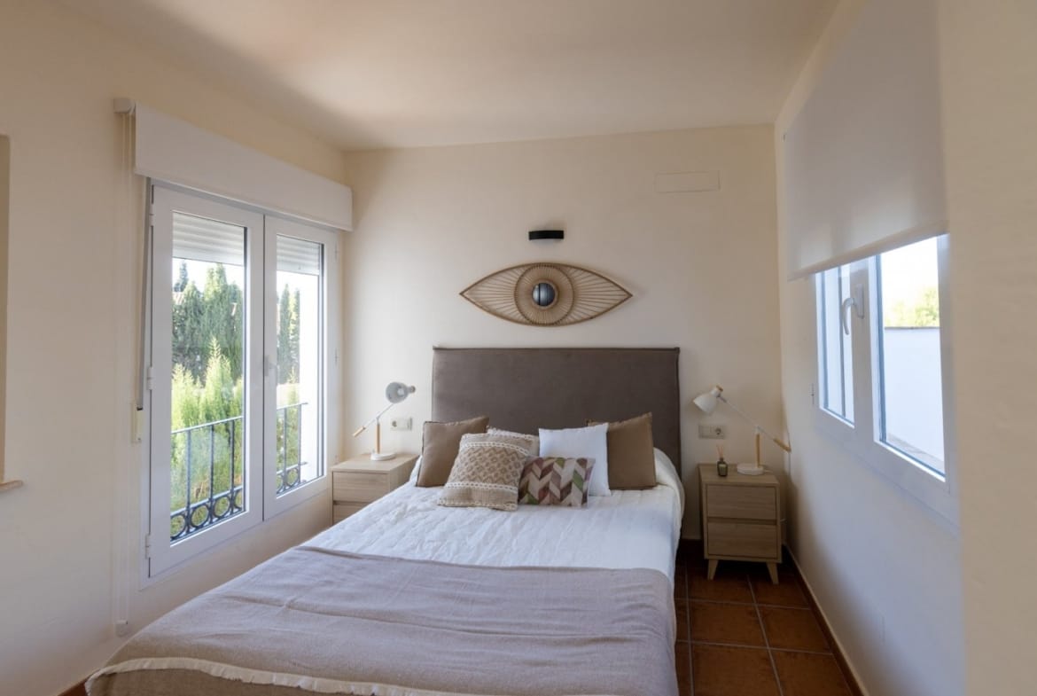 Double bedroom with patio doors and a curved ceiling in Las Palas, Fuente Álamo, Murcia