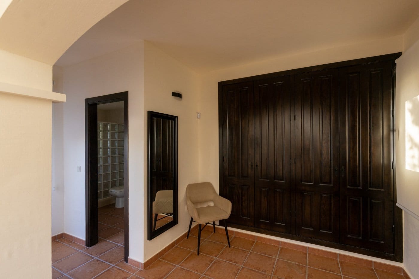 Bedroom dressing area with fitted wardrobes and a mirror in Las Palas, Fuente Álamo, Murcia