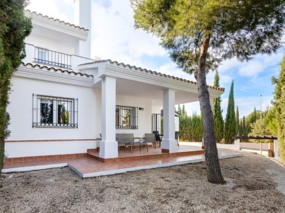 White villa exterior with a covered porch and gravel garden in Las Palas, Fuente Álamo, Murcia