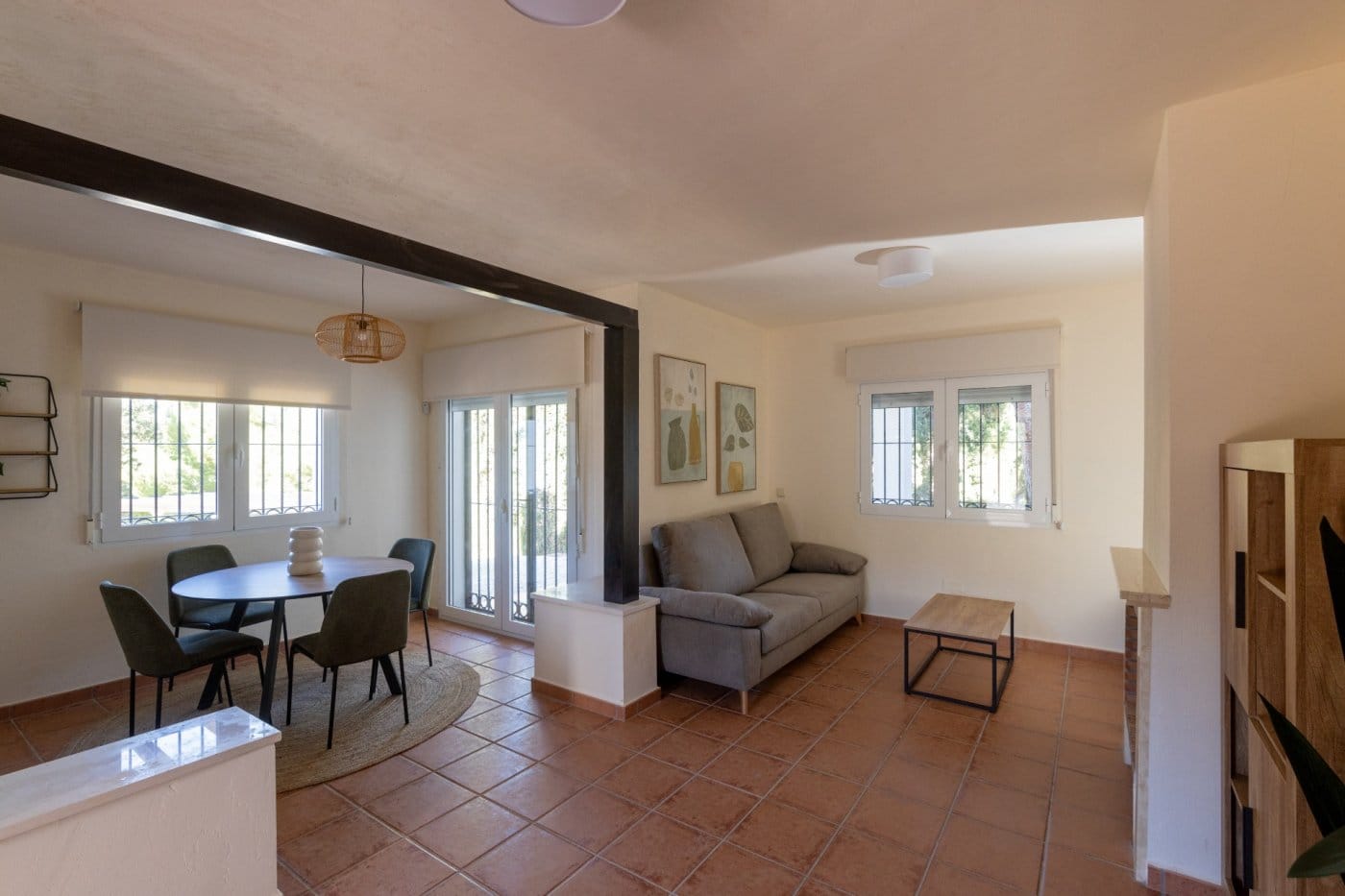 Living and dining room with timber beams and terrace doors in Las Palas, Fuente Álamo, Murcia