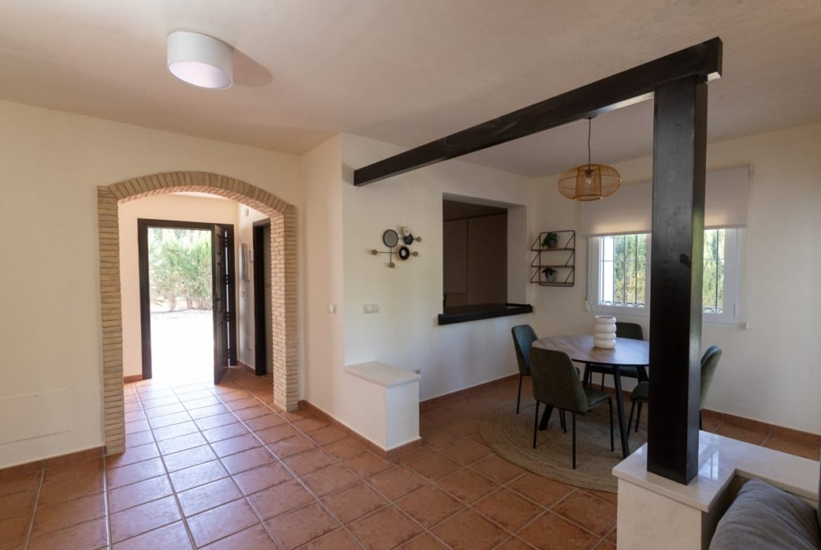 Entrance hall with a brick arch opening to the living area in Las Palas, Fuente Álamo, Murcia