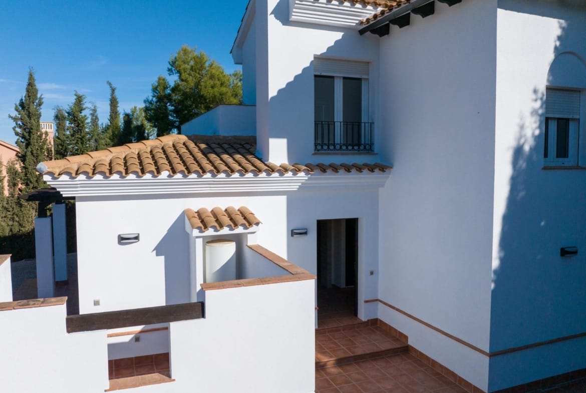 Tiled terrace beside white walls and a timber pergola in Las Palas, Fuente Álamo, Murcia