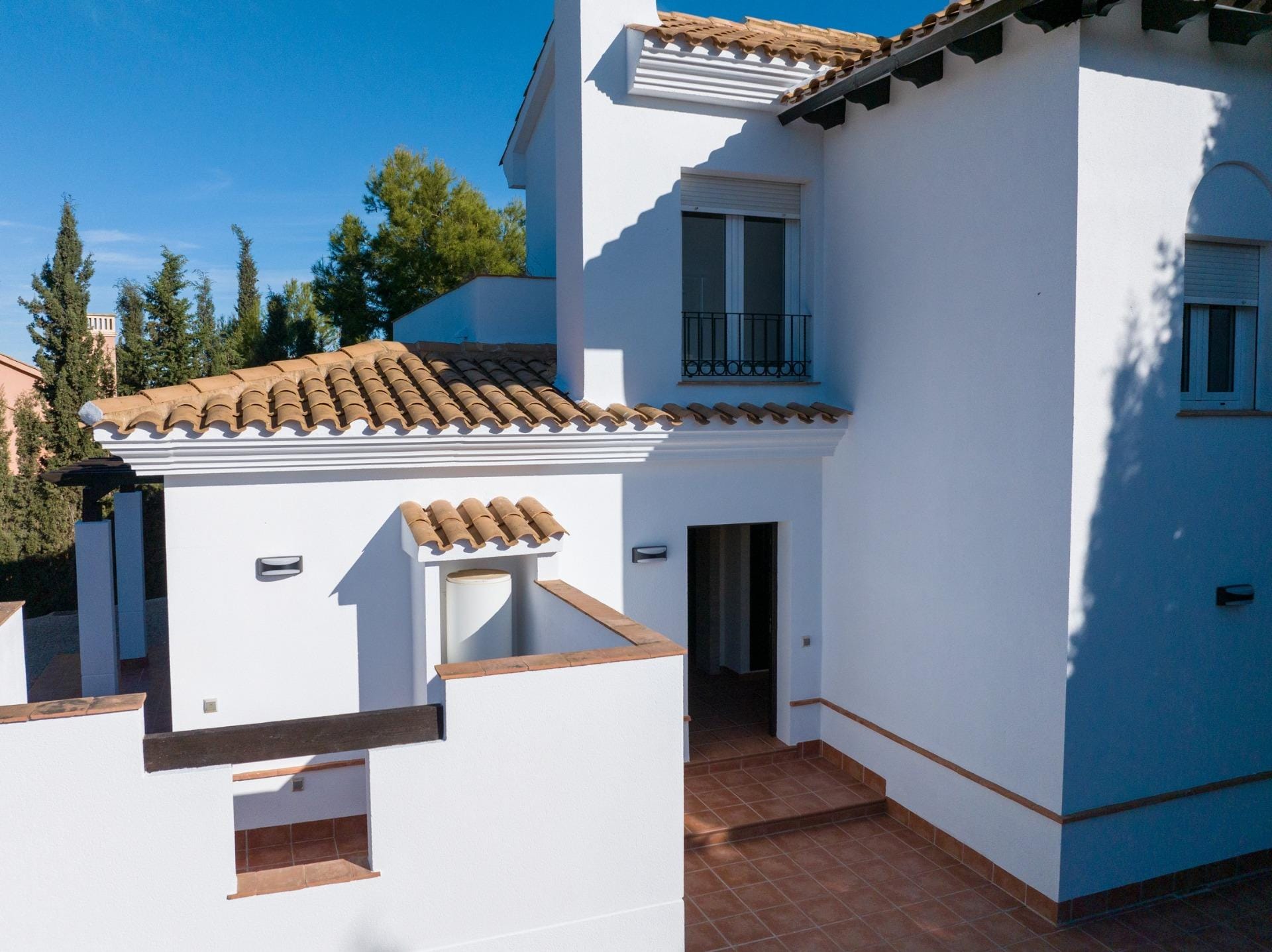 MURCIA Tiled terrace beside white walls and a timber pergola in Las Palas, Fuente Álamo, Murcia