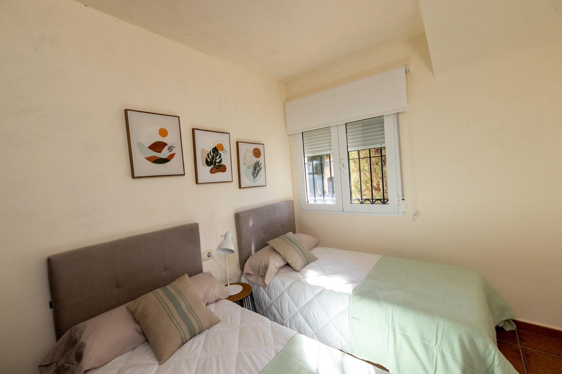 KEY-READY-TOWNHOUSES-IN-FUENTE-ALAMO-MURCIA-12 Twin bedroom with upholstered headboards and a window in Las Palas, Fuente Álamo, Murcia