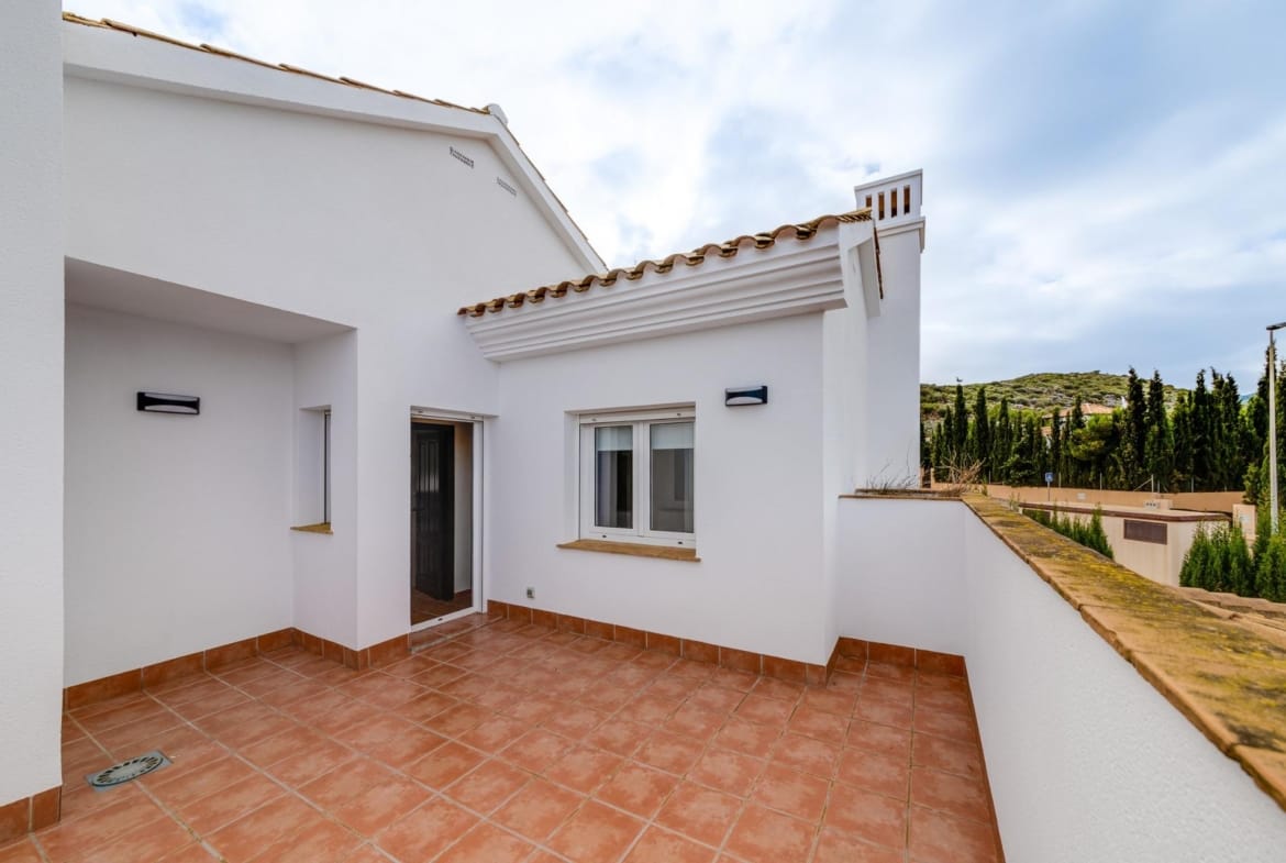 Terracotta-tiled terrace beside a white facade in Las Palas, Fuente Álamo, Murcia