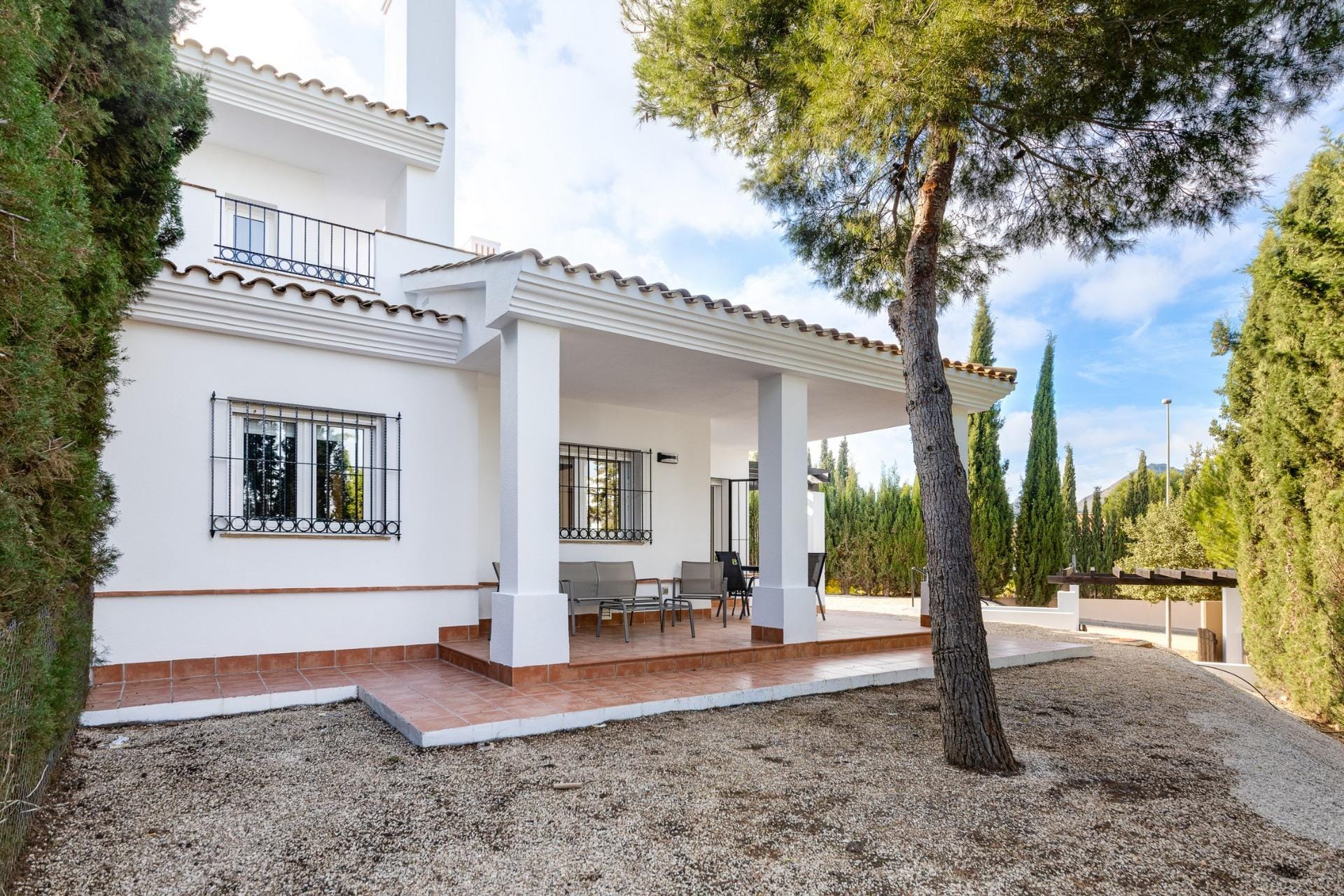 White house exterior with a covered porch and gravel garden in Las Palas, Fuente Álamo, Murcia