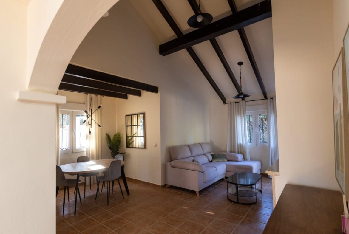 Arched doorway opening into a living and dining room in Las Palas, Fuente Álamo, Murcia