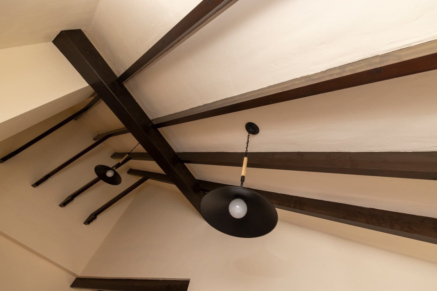 KEY-READY-VILLA-IN-FUENTE-ALAMO-MURCIA-16 Dark timber beams and a pendant light beneath a vaulted ceiling in Las Palas, Fuente Álamo, Murcia