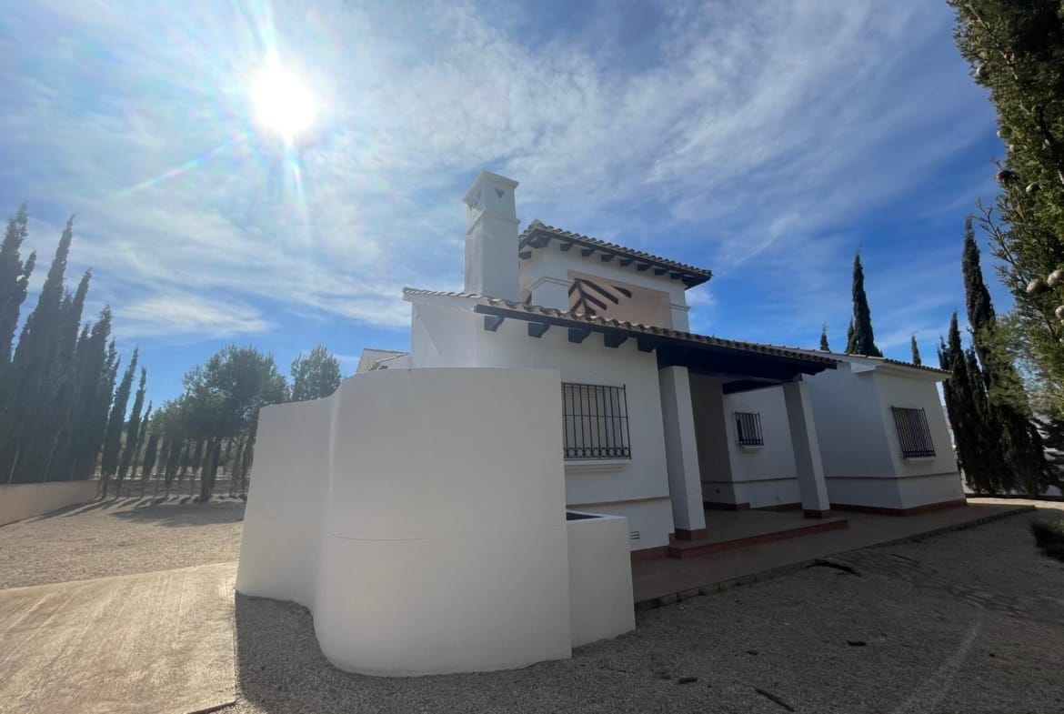 Side of a white villa with a tiled terrace and roof stairs in Las Palas, Fuente Álamo, Murcia