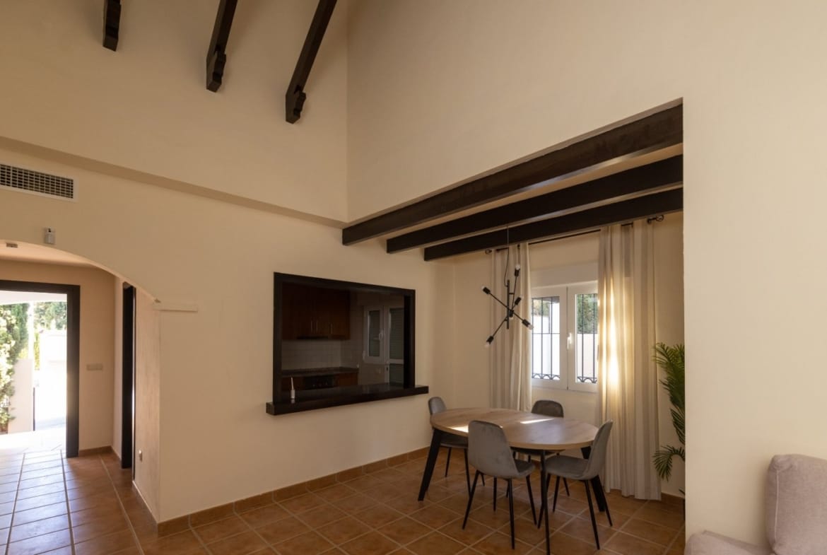 Dining area beside a kitchen serving hatch and terrace doorway in Las Palas, Fuente Álamo, Murcia