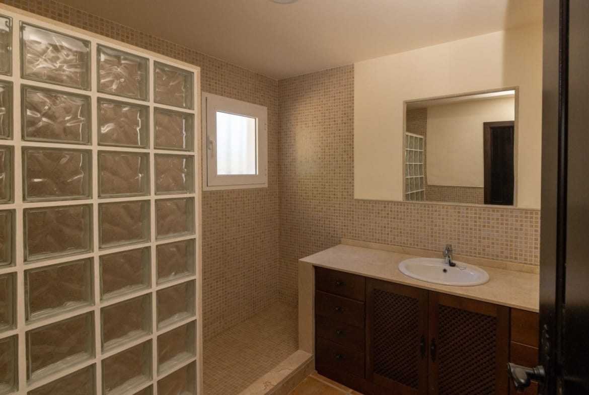 Bathroom with a glass-block shower screen and basin vanity in Las Palas, Fuente Álamo, Murcia