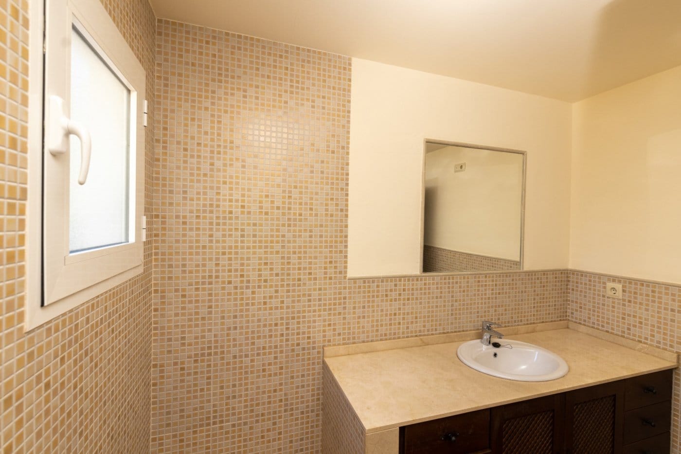 KEY-READY-VILLA-IN-FUENTE-ALAMO-MURCIA-29 Bathroom basin and mirror beside mosaic wall tiles in Las Palas, Fuente Álamo, Murcia