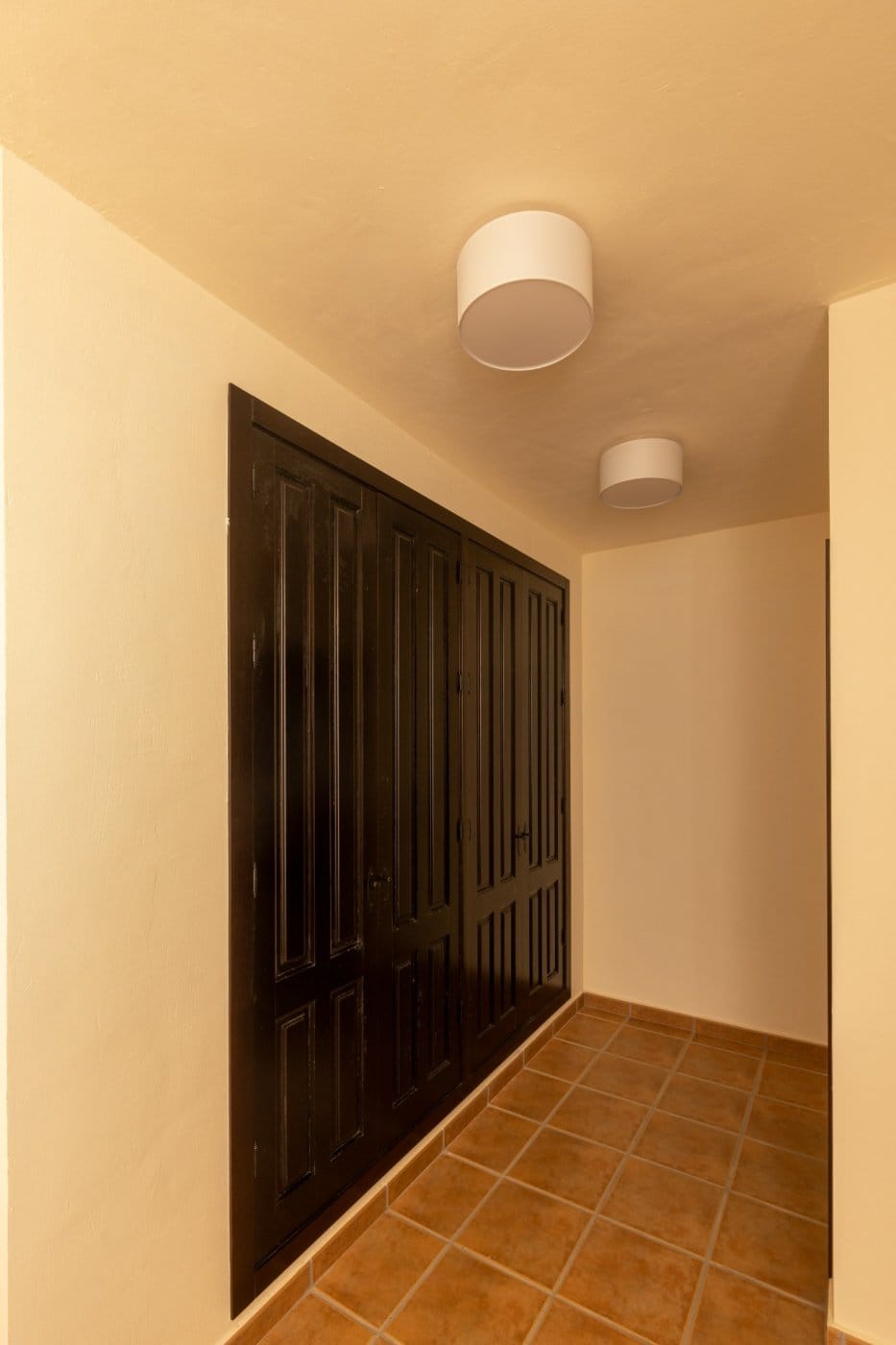 KEY-READY-VILLA-IN-FUENTE-ALAMO-MURCIA-33 Dressing area with dark fitted wardrobes and tiled flooring in Las Palas, Fuente Álamo, Murcia