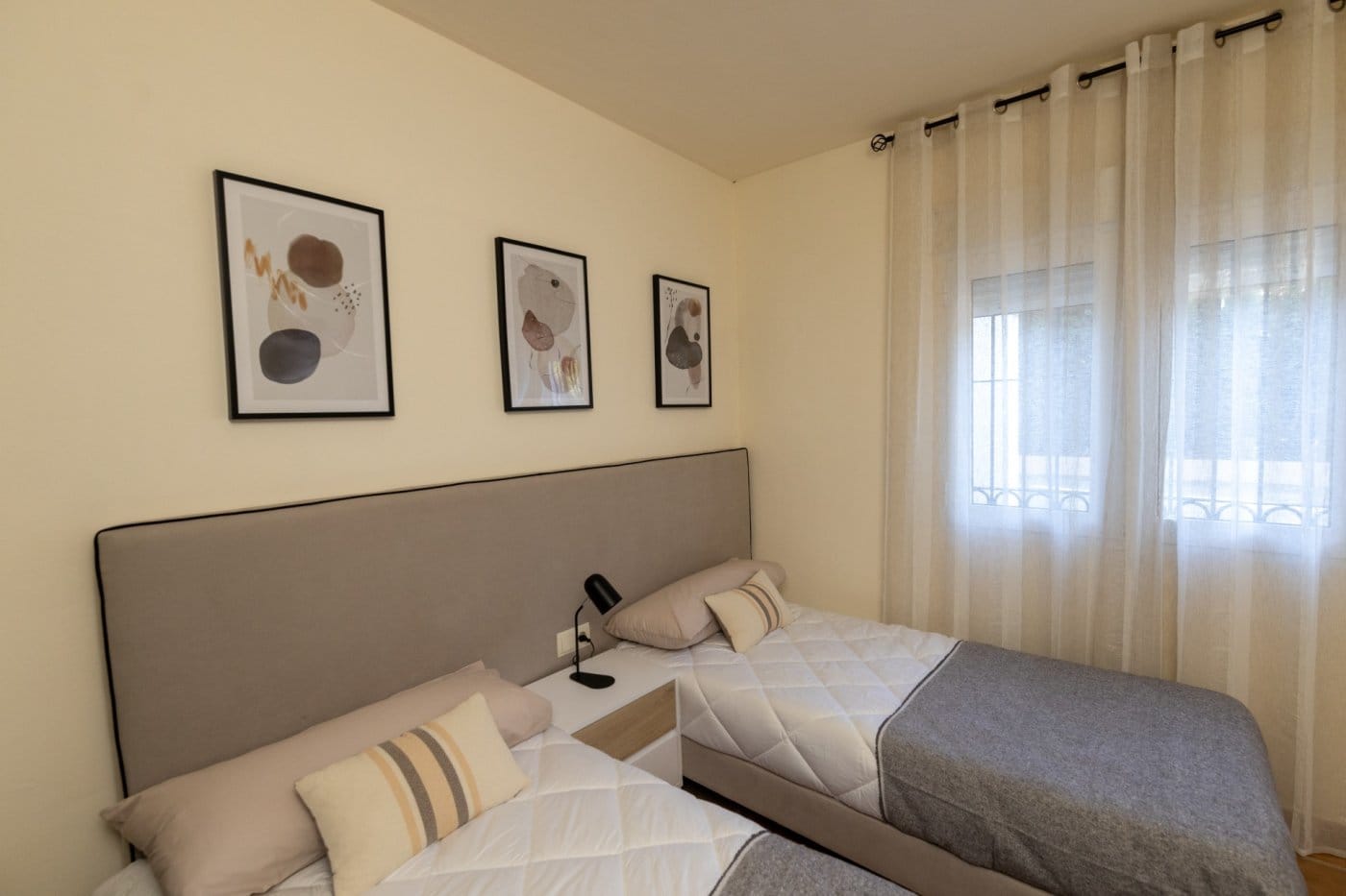 KEY-READY-VILLA-IN-FUENTE-ALAMO-MURCIA-8 Twin bedroom with framed artwork and a curtained window in Las Palas, Fuente Álamo, Murcia