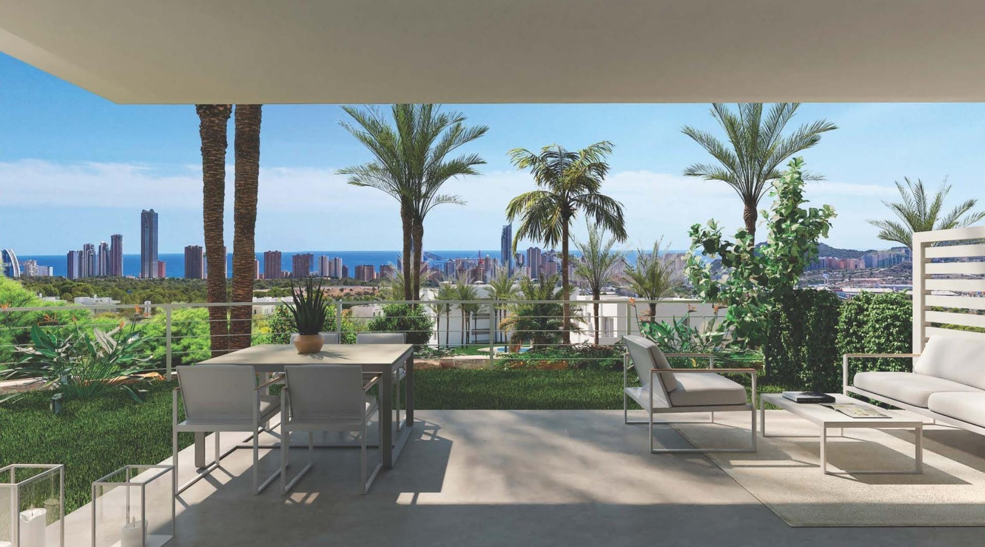 Covered terrace with a dining table, lounge chairs, palm trees and a distant coastal skyline in Sierra Cortina, Alicante