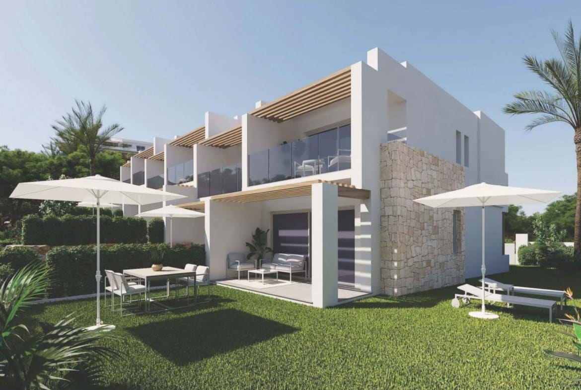 Contemporary townhouse facade with a covered patio, garden and upper balcony in Sierra Cortina, Alicante