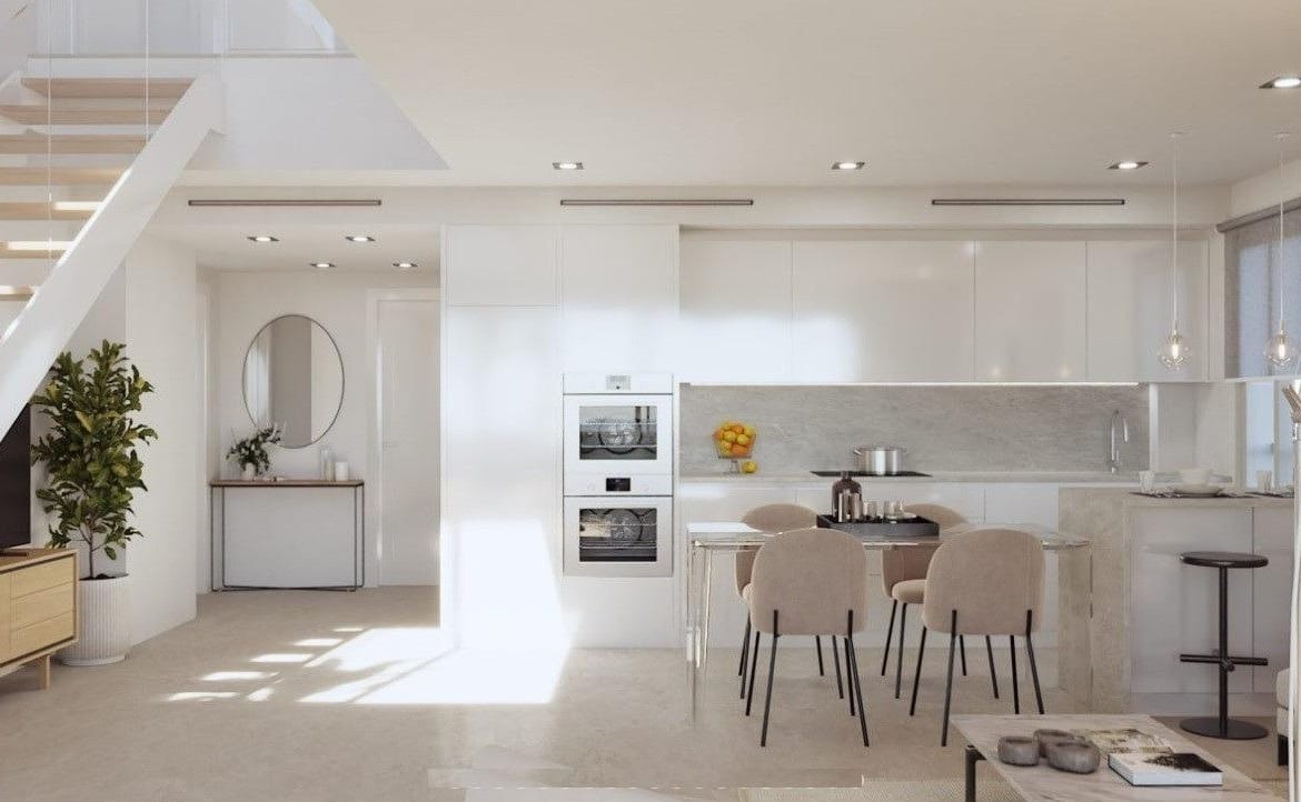 Open-plan townhouse living room and kitchen beside an internal staircase in Sierra Cortina, Alicante