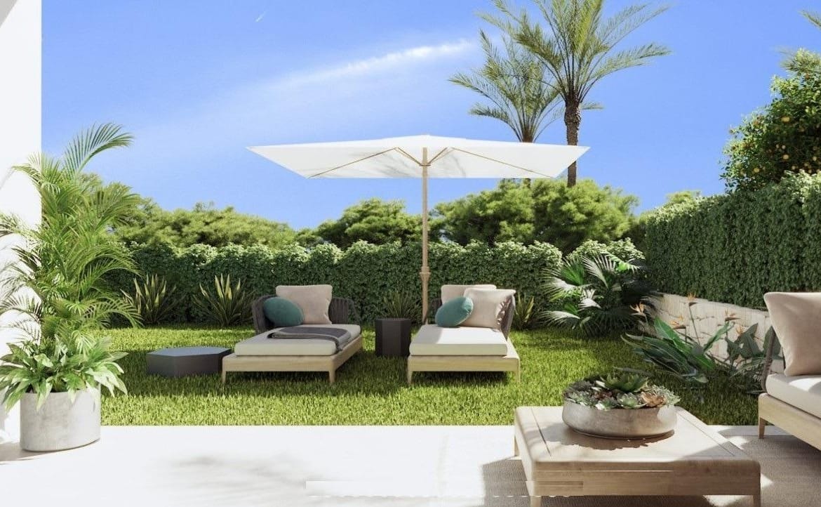 Covered garden patio with an outdoor sofa, lawn and loungers in Sierra Cortina, Alicante
