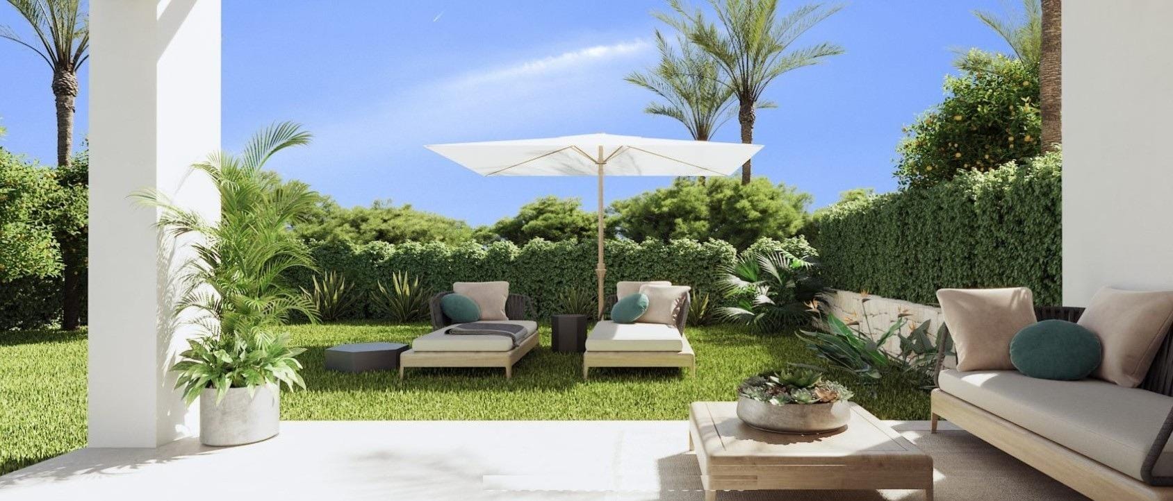 Covered garden patio with an outdoor sofa, lawn and loungers in Sierra Cortina, Alicante
