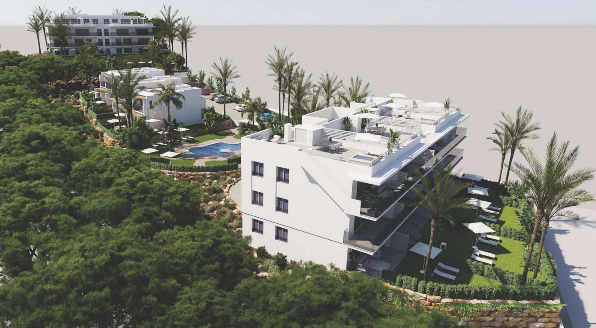 Aerial view of low-rise apartment buildings among landscaped gardens and palm trees in Sierra Cortina, Alicante