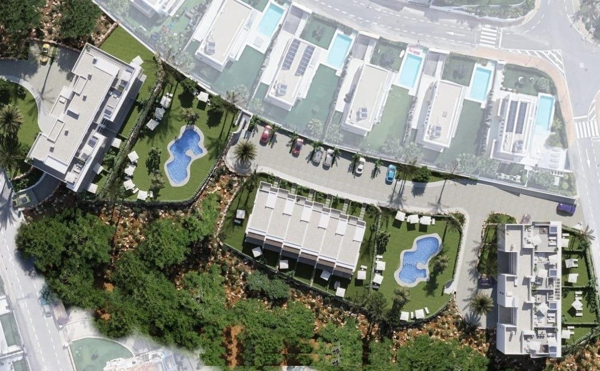 Overhead view of the residential buildings, landscaped gardens and 2 communal pools in Sierra Cortina, Alicante