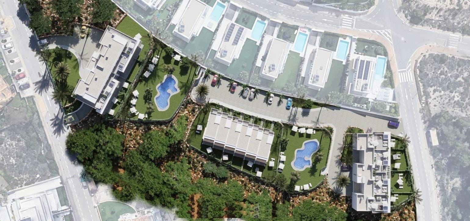 Overhead view of the residential buildings, landscaped gardens and 2 communal pools in Sierra Cortina, Alicante