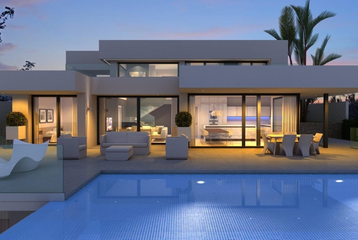 Dusk rendering of an illuminated villa beside its private swimming pool in Cumbre del Sol, Benitachell, Alicante