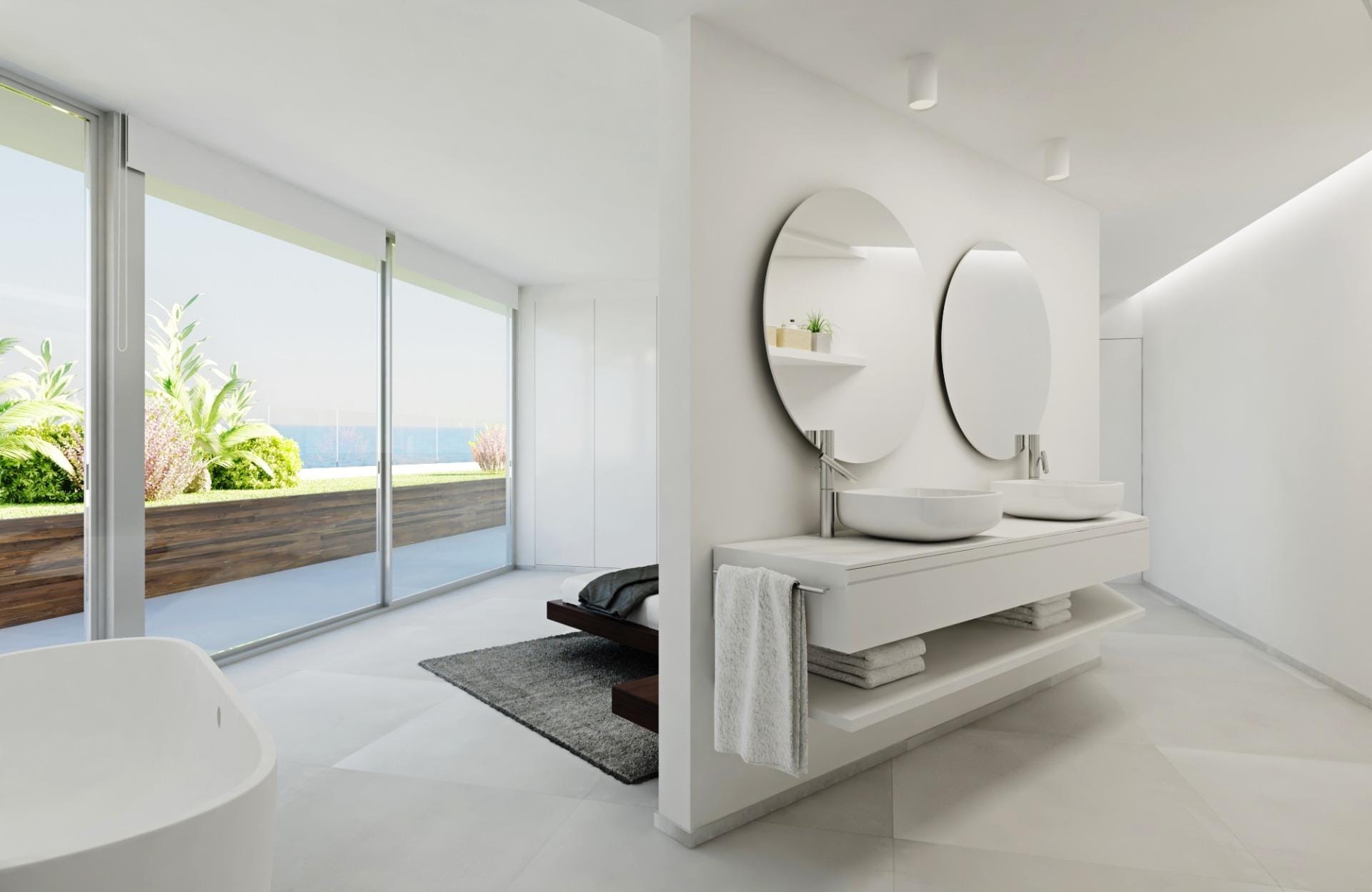 Bathroom rendering with twin basins, round mirrors and glazing towards an outdoor terrace in Mascarat, Calpe, Alicante