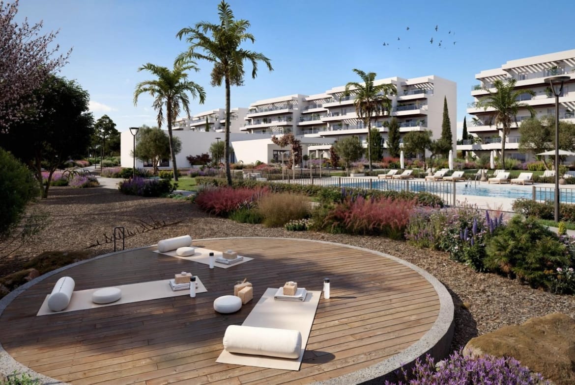 Outdoor exercise deck beside the pool and landscaped communal gardens in El Verger, Alicante