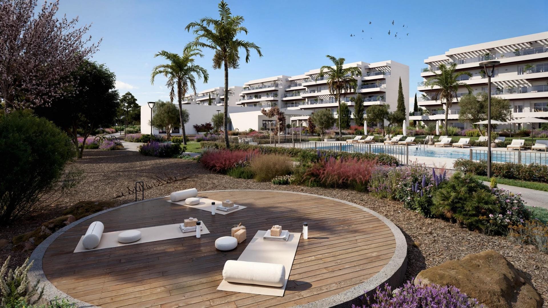 Outdoor exercise deck beside the pool and landscaped communal gardens in El Verger, Alicante