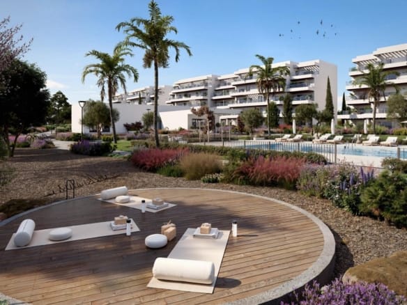 Landscaped communal gardens with yoga deck, pool and modern apartment buildings in El Verger, Alicante