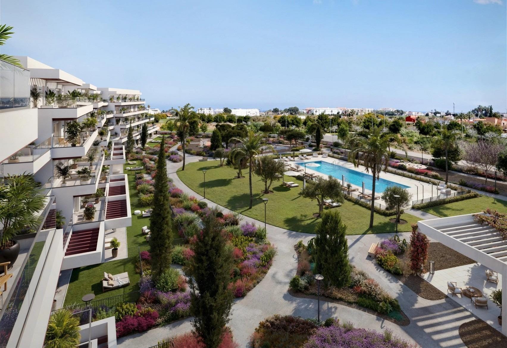 Elevated view over landscaped communal gardens and the swimming pool