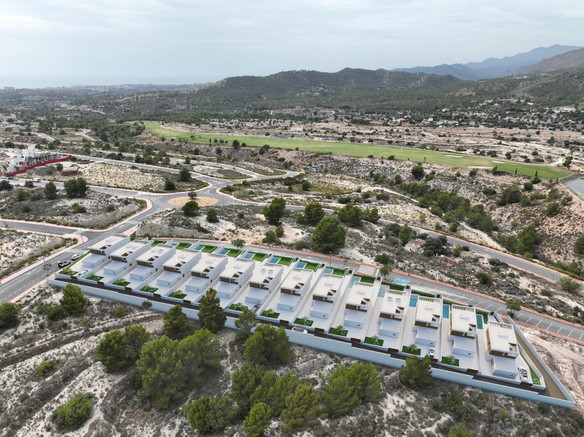 Aerial development rendering showing villas beside the surrounding hills and golf course in Puig Campana Golf, Finestrat, Alicante