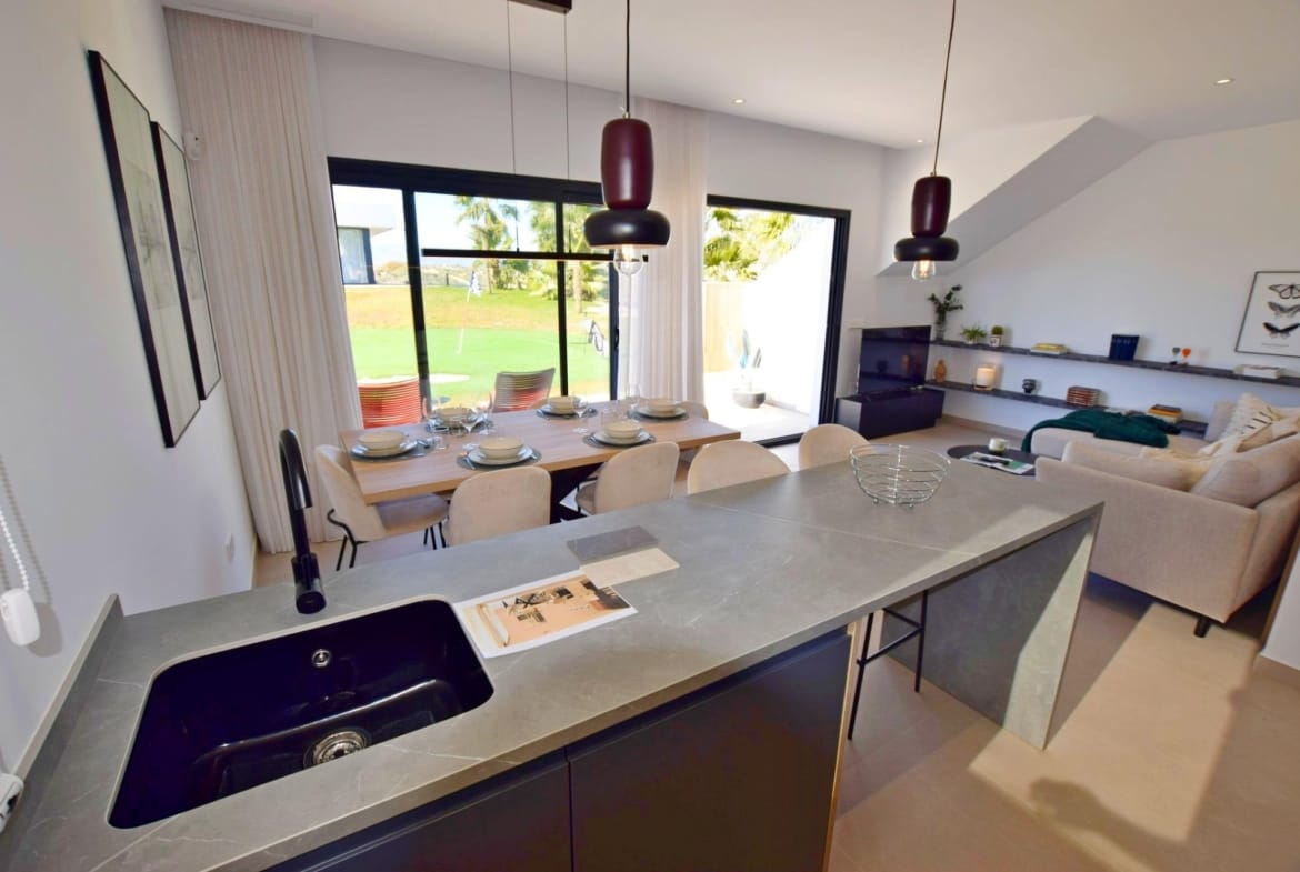 Open-plan kitchen and dining area looking toward the living room