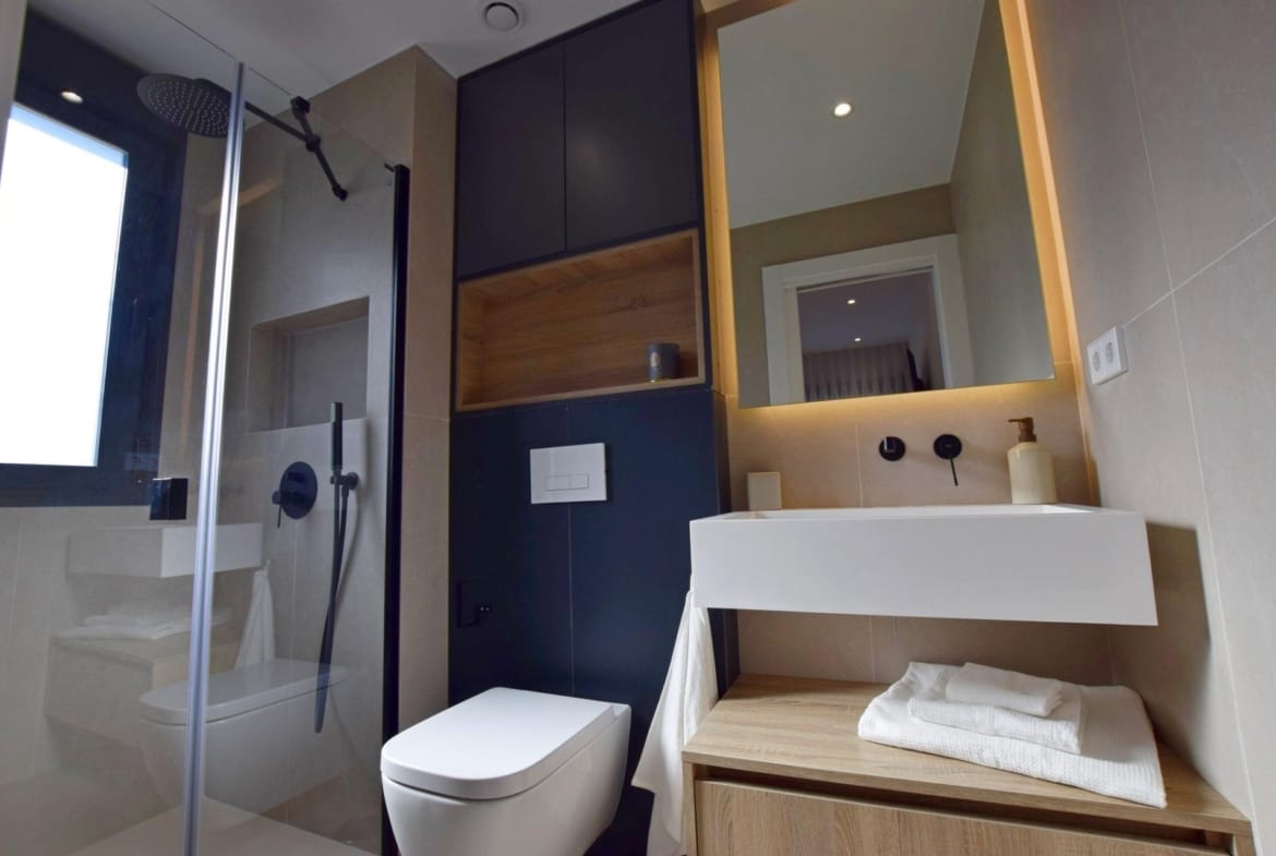 Modern bathroom with walk-in shower and floating vanity