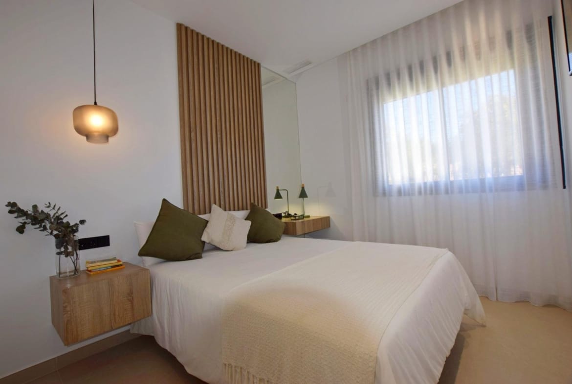 Bedroom with floating bedside tables and soft natural light