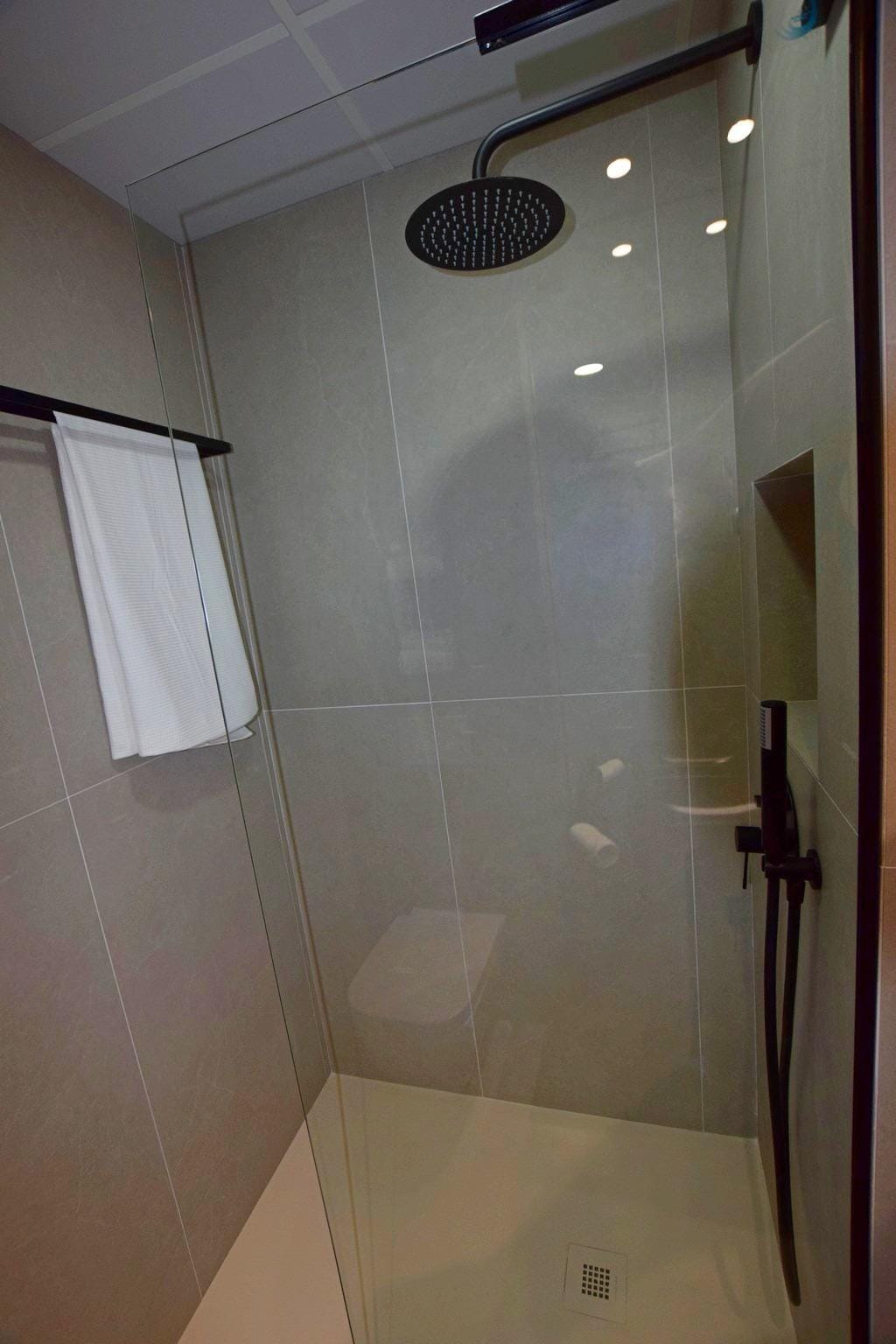 NEW-BUILD-APARTMENTS-IN-CONDADO-DE-ALHAMA-GOLF-COURSE-21 Walk-in shower with rainfall shower head and glass screen