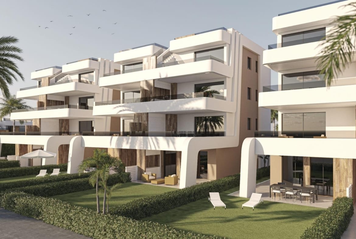 Modern apartment facade with private garden terraces and upper balconies