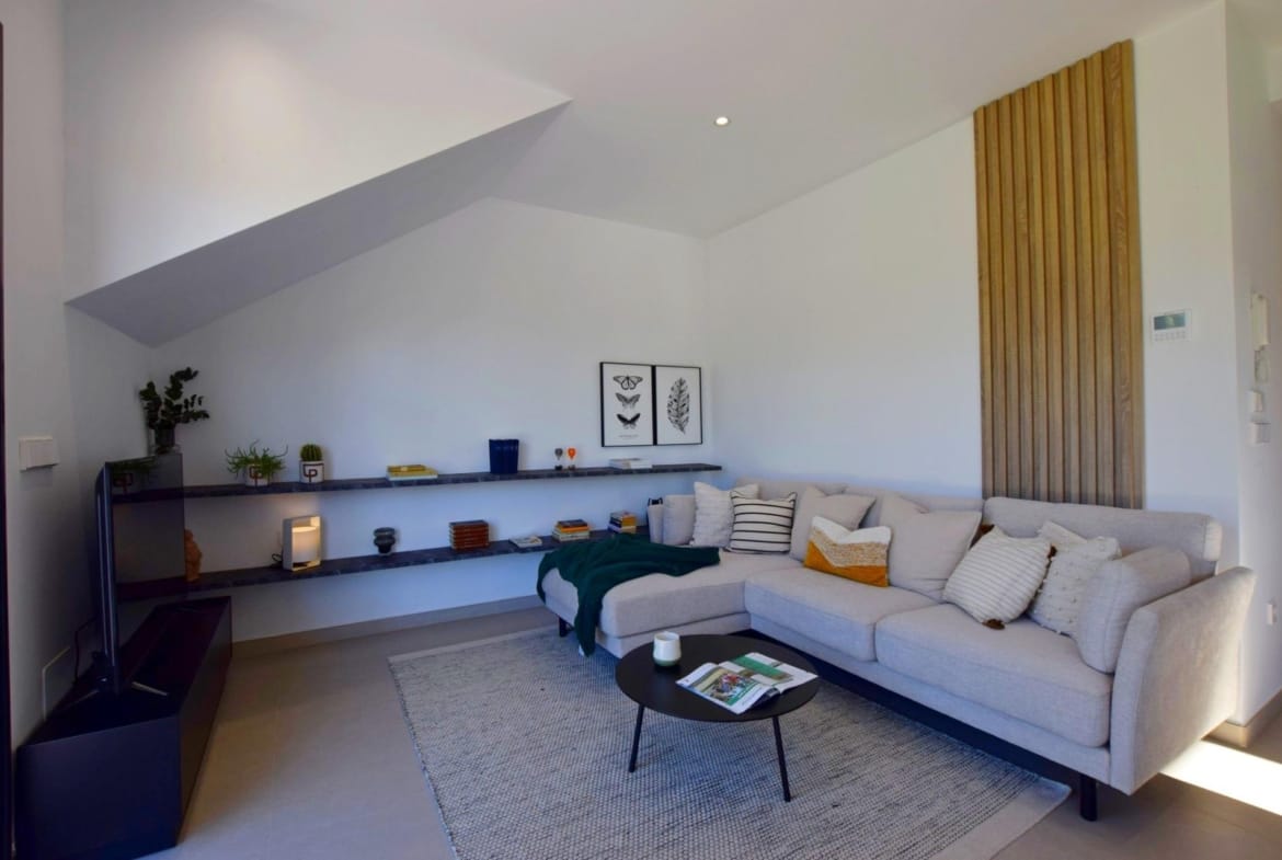 Contemporary living room with sectional sofa and built-in shelving